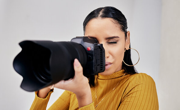 Black woman, photographer and camera for photoshoot, digital agency and production process. Photography, African American female and artist with device to shoot in studio, creative media and employee