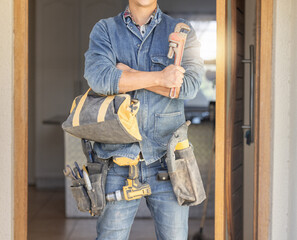 Handyman, tool bag and arms crossed at work with goals, property development and real estate...