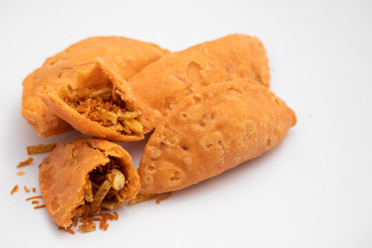 Indian Snacks Salted Dumpling, Namkeen Gujiya Or Deep Fried Farsan Gujia Stuffed With Spiced Mixture, Bhujiya, Spicy Sev, Crispy Namkin Is Enjoyed On Festivals Like Holi, Diwali and Navaratri