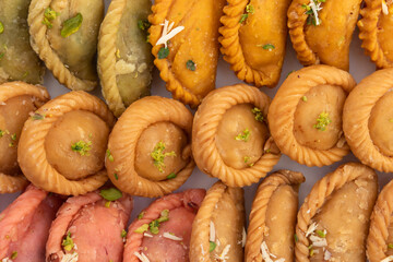Various Indian Sweet Dumpling Mithai - Rose Gujiya, Karanji, Chandrakala, Suryakala, Kesar Gujia, Thandai Pedakiya Also Called Pirukiya, Pirukia, Basundi, Gughra For Deepawali, Teez Holi, Diwali, Teej