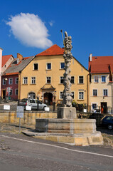 Fototapeta premium Fountain with a statue of St. Maternus and Kargul and Pawlak Museum. Lubomierz, Lower Silesian Voivodeship, Poland.