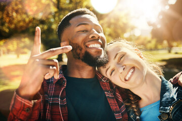 Fototapeta premium Couple smile, selfie peace sign and portrait outdoors, enjoying fun time and bonding at park. Interracial, love romance and black man and woman with v hand emoji for taking pictures for happy memory.
