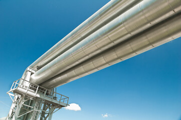 Pipeline against the blue sky and clouds, bottom view