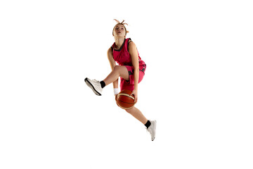 Jump shot. Teen girl, basketball player in action, jumping with ball isolated over white studio background. Concept of sportive lifestyle, active hobby, health, endurance, competition. Ad