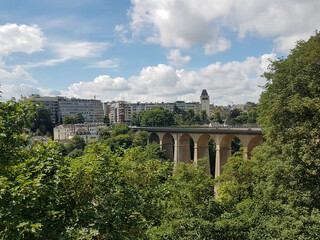 Beautiful bridge, modern buildings and green trees in Luxembourg City