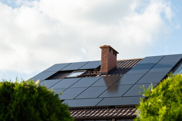 New ecologic house with solar panels Alternative to conventional energy. The battery is charged...