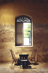 table set under the antique window
