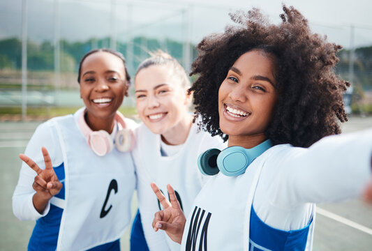 Friends, selfie and women in portrait, netball and sports with team on court outdoor, smile and peace hand sign. Diversity, headphones and gen z with fitness, train for game and happy in picture