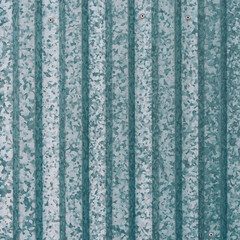 Minimal simple background of gray metallic stripy fence close up. Full frame of silver metal wall...