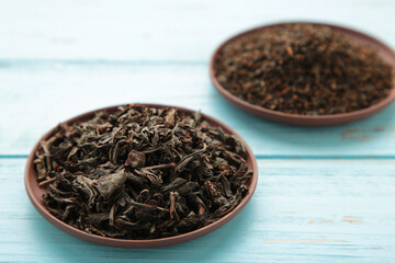 Assortment of dry tea on blue background. Space for text