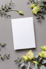 Blank wedding invitation or greeting card mockup with flowers