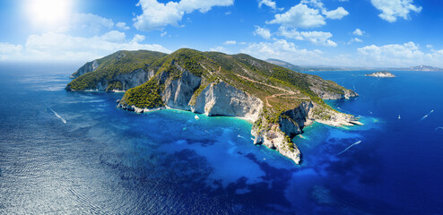 Aerial, panoramic view of the south coast of Zakynthos island, Greece, with the famous beaches and caves at the Keri area, popular daytripping destination for boats - obrazy, fototapety, plakaty