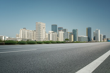 Fototapeta na wymiar road and city buildings background