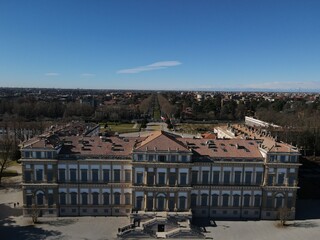 Naklejka premium Aerial view of facade of the elegant Villa Reale in Monza, Lombardy, north Italy. Birds eye of the beautiful Royal Palace of Monza. Drone photography in Lombardia.