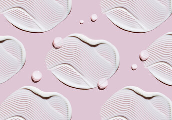 pattern cosmetic smears cream texture on pastel pink background