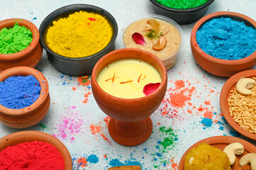 top view of colorful traditional holi powder in bowls isolated on dark background.Space for text . happy holi.Concept Indian color festival called Holi