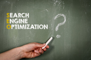 Search Engine Optimization. Question mark on a green chalkboard