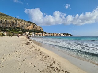 Mondello, Sicily, evocative image of the beach with clear water and a beautiful blue sky