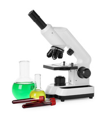 Laboratory glassware with colorful liquids and microscope isolated on white