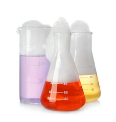 Laboratory glassware with colorful liquids isolated on white. Chemical reaction