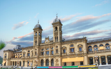 Naklejka premium City hall in San Sebastian (Donostia) on a beautiful summer vacation day with some cloud in the sky. 