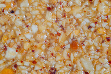 Honey granola hazelnuts bar - Gozinaki - caramelized nuts fried in honey - close up. Traditional Georgian cuisine, oriental sweet, gastronomy and food concept
