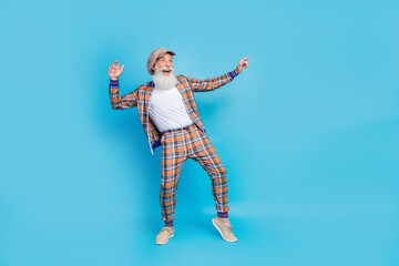 Full length photo of positive cheerful artist showman stylish outfit look up empty space event feel...