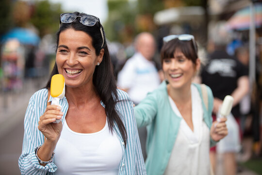 Female Friends Eating Ice Creams