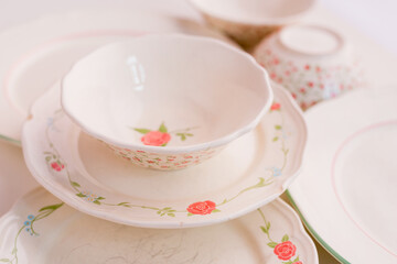 Closeup of porcelain plates and bowls