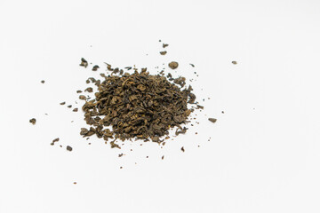 Close-up of dry green tea on white background. Top view. Close up.
