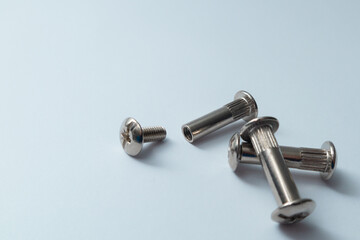 Furniture ties or screws. Сoupling bolt on a white background