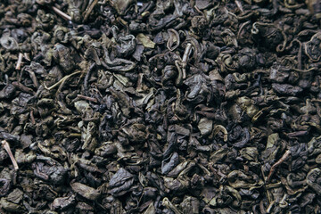 Green Tea background. Close-up shot of dry green tea