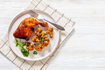 baked chicken leg with spicy roast cauliflower
