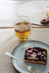 ndulge in a Delicious Morning Treat - Hot Tea in a Thermoglass and Freshly Baked Blueberry Cake - The Perfect Balance of Sweetness and Flavor to Start Your Day