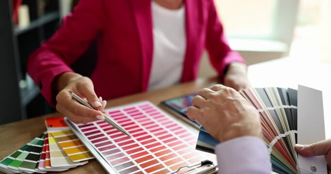 Designer and client make choice of colors in color palette