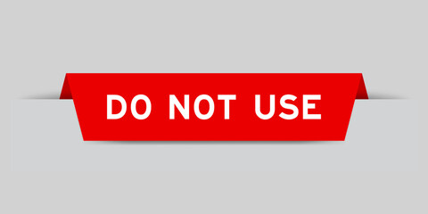 Red color inserted label with word do not use on gray background