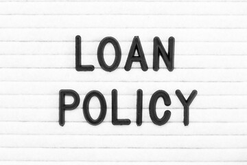 Black color letter in word loan policy on white felt board background
