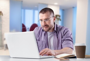 Fototapeta na wymiar Accounting Clerk business Man work on laptop in office