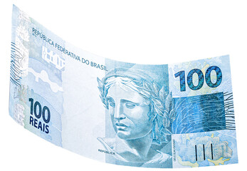 banknote of one hundred reais from brazil falling on isolated white background - obrazy, fototapety, plakaty