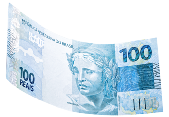 banknote of one hundred reais from brazil falling on isolated white background