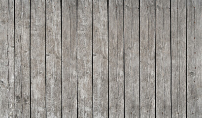 Old vintage gray wooden planks fence