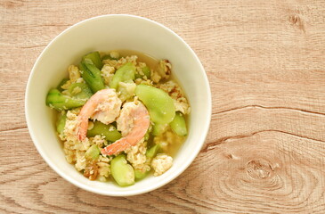 stir fried ridge gourd with egg and shrimp on bowl