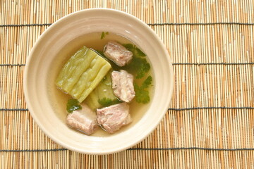 boiled bitter melon with  pork bone in clear soup on bowl