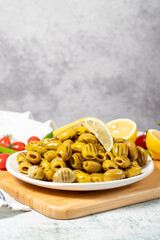 Grilled olives. Tasty Green grilled olives in the plate. Healthy food. Low angle view