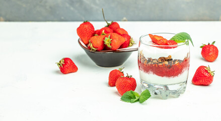 strawberry parfaits with fresh fruit, yogurt and granola. Delicious breakfast or snack, Clean eating, dieting, vegan food concept