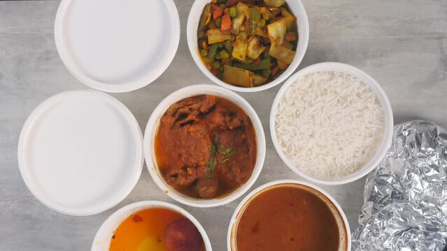 Indian Thali served in a white paper cups