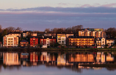Fototapeta premium Houses on a street in Galway, Ireland are reflected on the surface.
