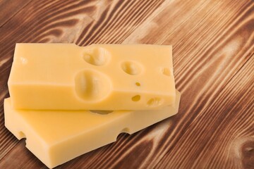 Tasty fresh cheese on kitchen desk