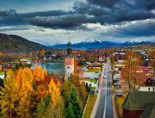 Fototapeta na wymiar The autumn landscape of Bialka Tatrzanska village with a view of the Tatra Mountains. Poland