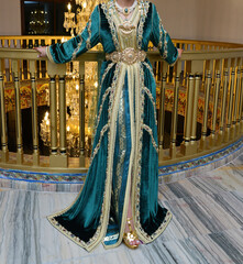 Moroccan bride wearing a green caftan